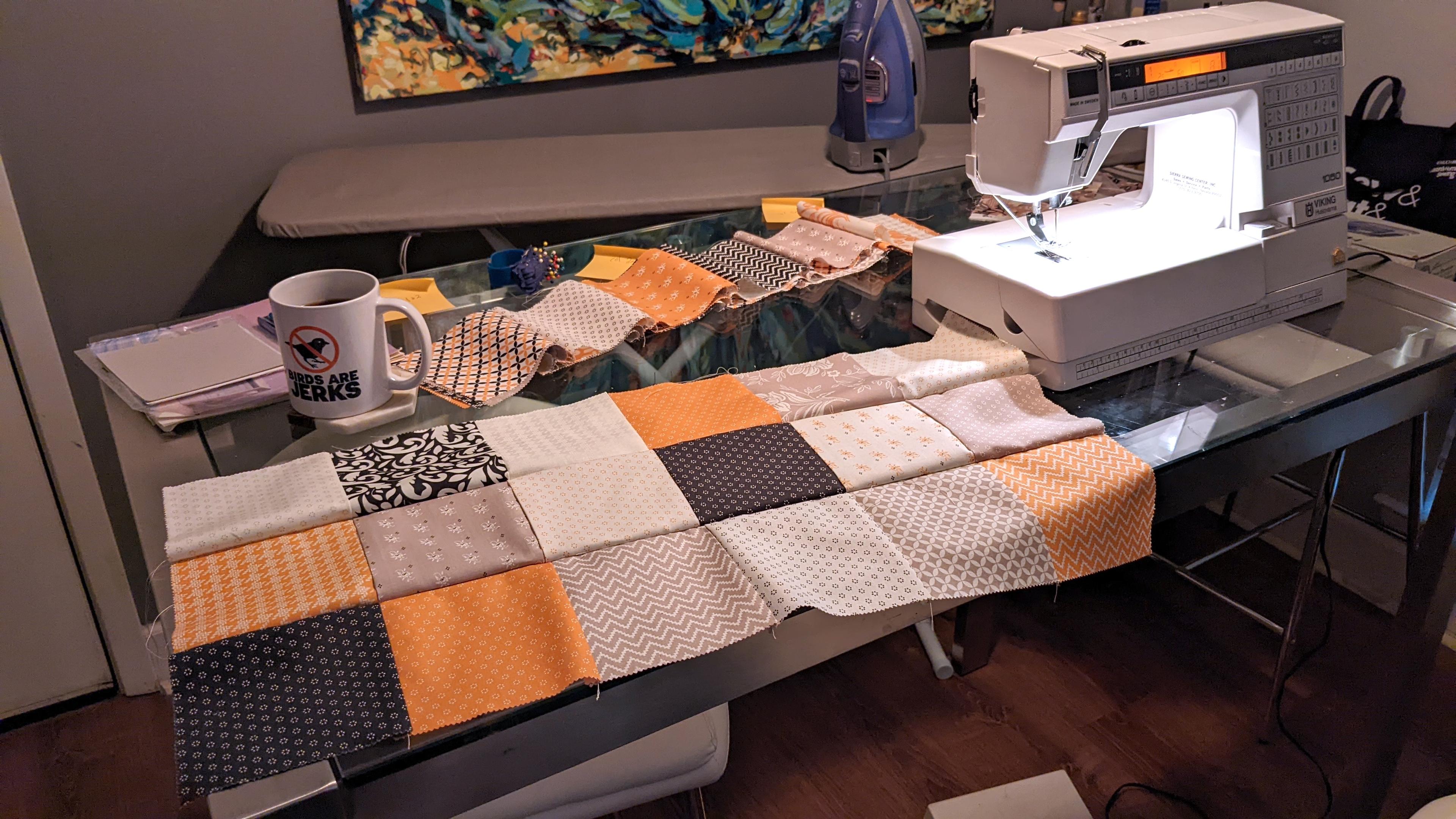 Three rows of piecing complete (6x3 squares), with an unattached completed chain piece in the background.