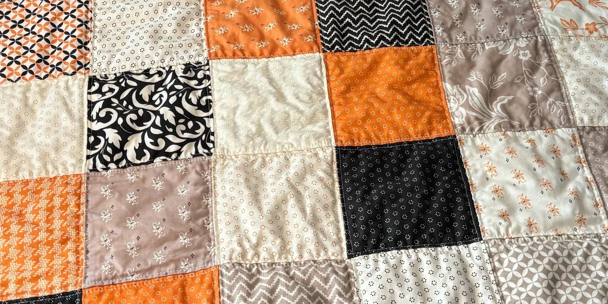 Close-up of the top of the quilt. The lines of quilting are visible.