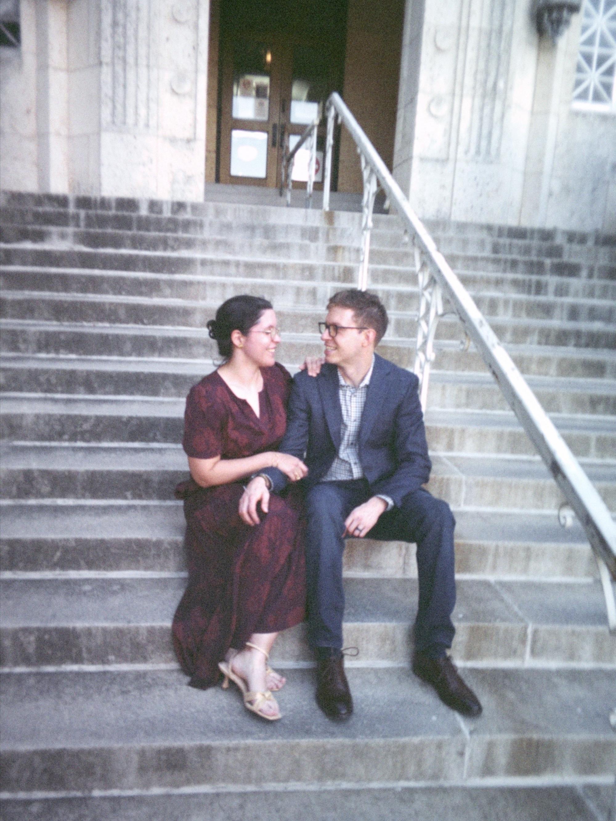 My husband and I sitting on the steps of the historic Travis County Courthouse after getting married.